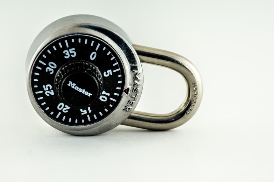 Combination padlock on a white surface